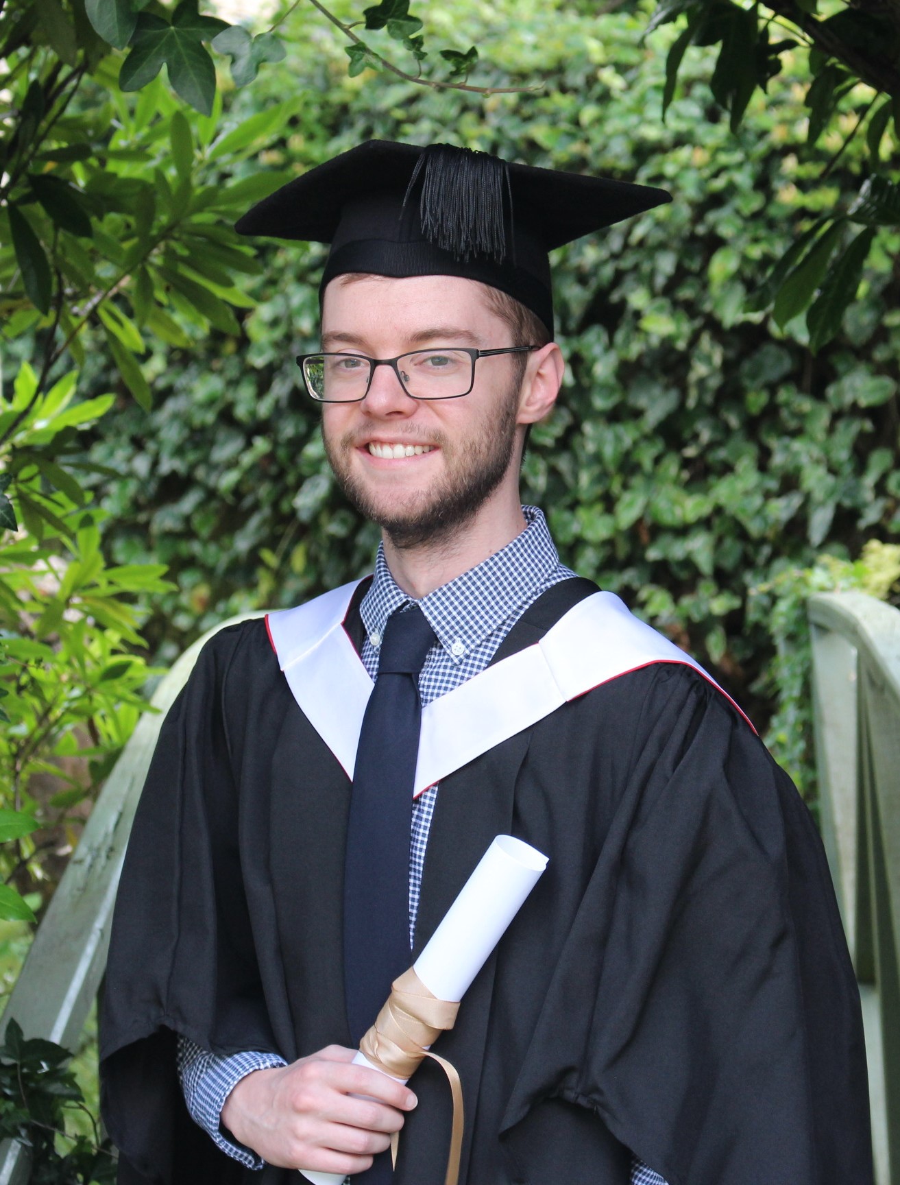 A picture of Joe in graduation gowns.